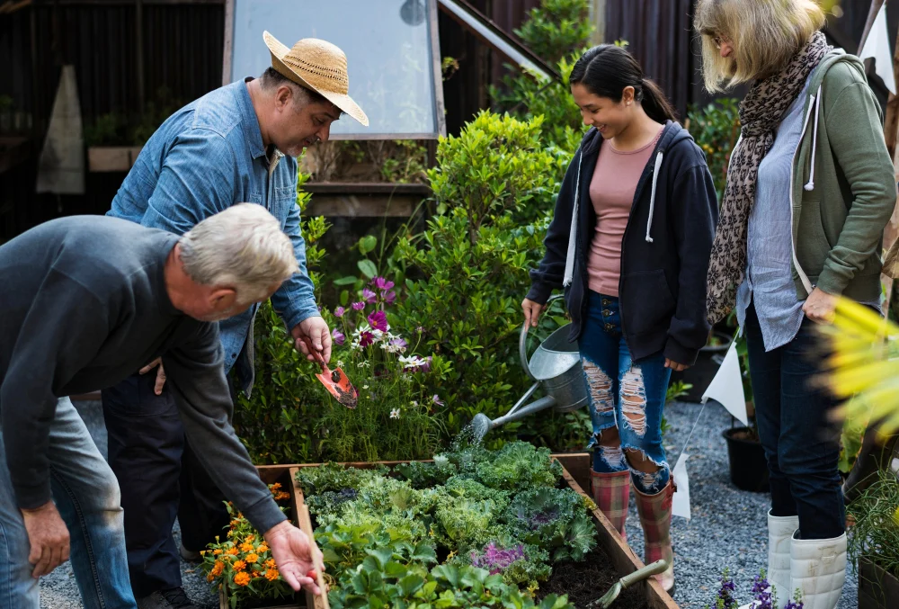 Adults of different ages taking part in a community gardening activity together
