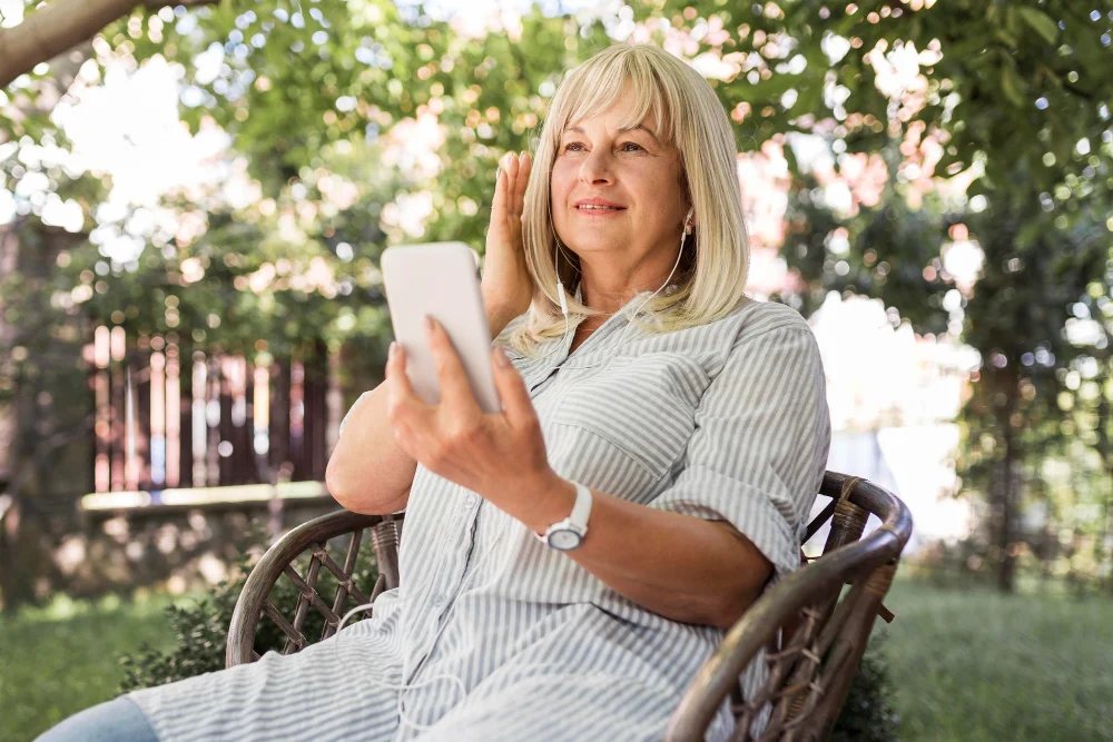 Family carer relaxing outdoors during respite care break