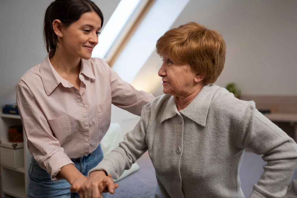 NDIS Daily Living Support at Home Support worker assisting an older NDIS participant with daily living at home