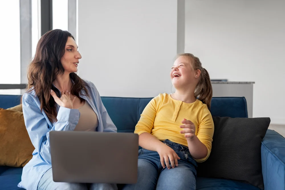 Participant and support person discussing NDIS plan at home