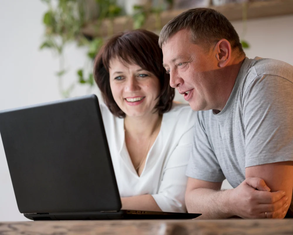 Two family members researching support providers online Two family members researching support providers online