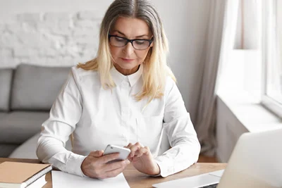 Woman checking NDIS appointment on phone