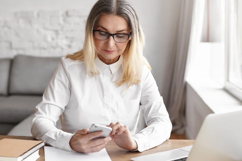 Woman checking NDIS appointment on phone