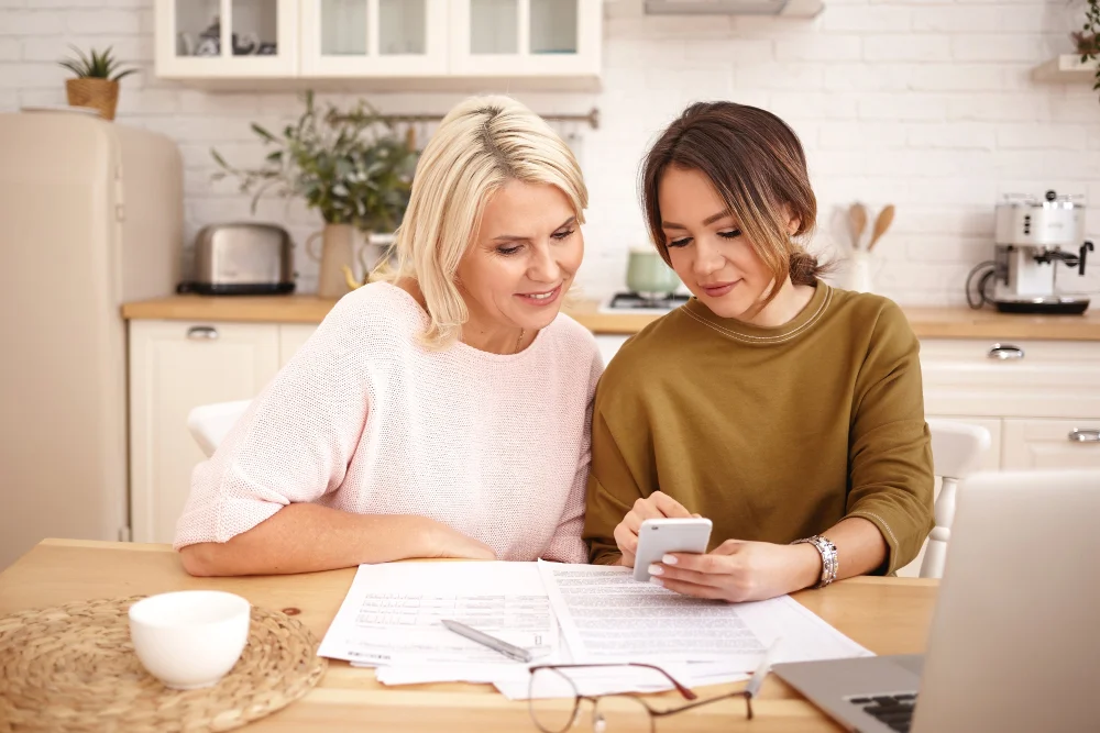 woman reviewing aged care fees and support information with a family member